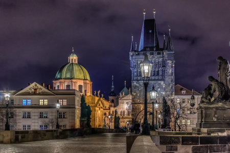 Pedestrians only Charles Bridge a.k.a. Stone Bridge, Kamenny most, Prague Bridge, Prazhski most over Vltava river in Prague, Czech Republic after sunsetのeditorial素材