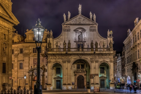 Klementinum located near Charles Bridge a.k.a. Stone Bridge, Kamenny most, Prague Bridge, Prazhski most in Prague, Czech Republic after sunsetのeditorial素材