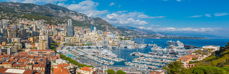 Monte Carlo city panorama. View of luxury yachts and apartments in harbor of Monaco, Cote d'Azur. Principality of Monaco is a sovereign city state, located on the French Riviera in Western Europe.の写真素材