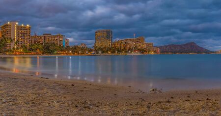 Night view of Waikiki Beach and Diamond Head in Honolulu at night in Hawaii, USA