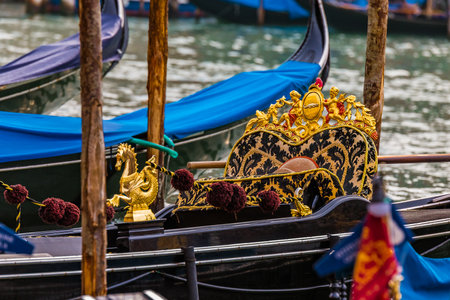 Traditional venetian gondola in a picturesque Venice Canal - Venice, Italyのeditorial素材