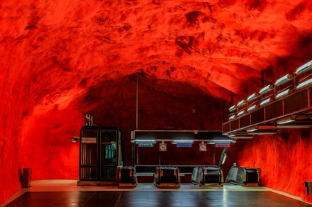 Stockholm underground metro or tunnelbana station Solna Centrum with fire like wall designsのeditorial素材