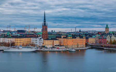 Stockholm, Sweden - October 24, 2017: Panoramic view across Lake Malaren onto traditional gothic buildings in the old town, Gamla Stan and Riddarholmen church, the burial church of Swedish monarchsのeditorial素材