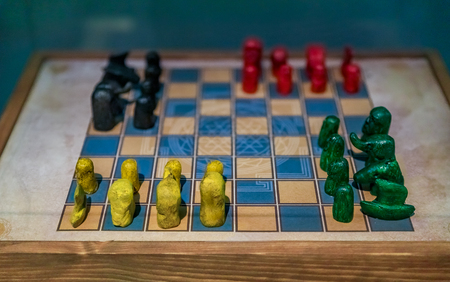 Antique chaturanga game board with pieces. It's an ancient Indian strategy board game from Gupta...