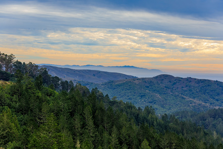Fog and clouds rolling in around sunset at Mount Tamalpais north of San Francisco California