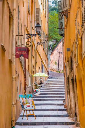 Nice, France - October 6, 2016: Narrow crooked street in the Old Town, Vieille Ville in Nice, French Rivieraのeditorial素材