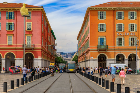 Nice, France - May 24, 2018: Tram pulls onto Place Massena, major commercial and cultural landmark in Niceのeditorial素材