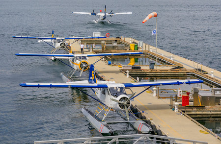 De Havilland Beaver sea planes docked at Harbour Airport at Coal Harbour district in Vancouver...