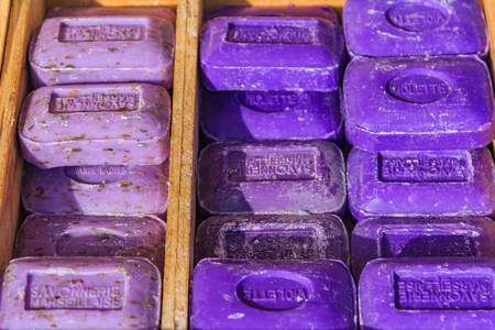 Colorful natural handmade French soap with lavender and violet scent in wooden boxes at a market in Marseille, Provence, Franceの写真素材