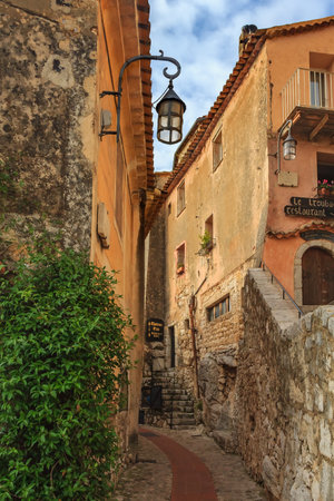 Eze, France - October 14, 2013: Old buildings and narrow cobblestone streets in a picturesque...