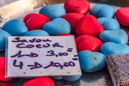 Colorful natural handmade French soap shaped like a heart at a market in a medieval city Eze Village, Provence, Franceの写真素材