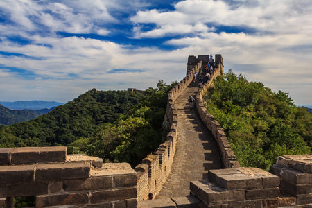 Mutianyu, China - September 19, 2013: Unidentified tourists walking on the Great Wall of China, in the Mutianyu village, one of remote parts of the Great Wall near Beijingのeditorial素材