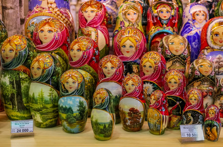 Sankt-Peterburg, Russia - October 05, 2015: Display of colorful traditional Russian matryoshka nesting dolls on a shelf with a price tag, in a souvenir shop in Saint Petersburg Russiaのeditorial素材
