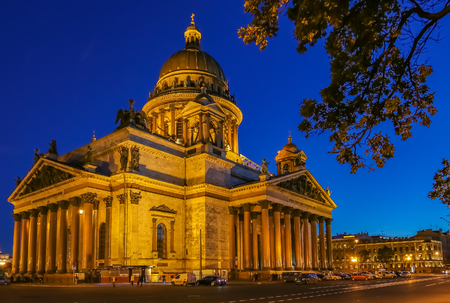 Illuminated facade of Saint Isaac's Russian Orthodox Cathedral in Saint Petersburg, Russia at sunsetの写真素材