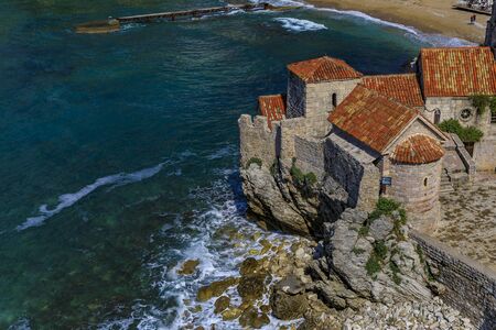 Aerial view of Budva Old Town from the Citadel with Richard s Head beach and Adriatic Sea in the...