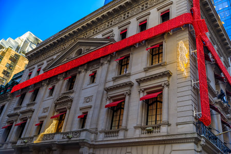 New York, USA - December 07, 2018: Christmas lights decorations of red ribbon and jaguar the Cartier store on Fifth Avenue in Manhattan, New York, USAのeditorial素材