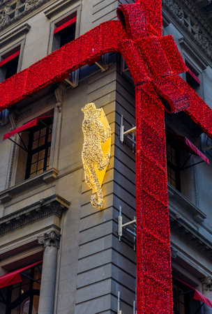 New York, USA - December 07, 2018: Christmas lights decorations of red ribbon and jaguar the Cartier store on Fifth Avenue in Manhattan, New York, USAのeditorial素材