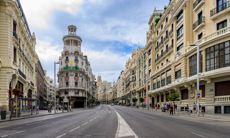 Madrid, Spain - June 5, 2017: Panorama with famous Edificio Grassy building with the Rolex sign and beautiful buildings on Gran Via shopping streetのeditorial素材