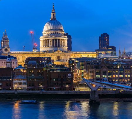 London, England - January 14, 2018: View of the famous St. Paul's Cathedral across the river Thames with Millennium Bridge at sunsetのeditorial素材