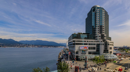 Vancouver, Canada - July 07, 2019: Panoramic aerial view of the modern architecture at Canada Place, Convention Center and harbor with mountainsのeditorial素材