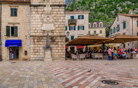 Kotor, Montenegro - May 30, 2019: Picturesque cobblestone city square of the medieval Old town with shops, cafes and restaurants in the Balkansのeditorial素材