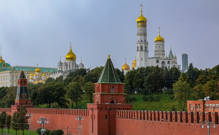 The Kremlin wall, onion domes of cathedrals and Grand Kremlin Palace blurred in a winter snow storm with snowflakes in the air in Moscow, Russiaのeditorial素材