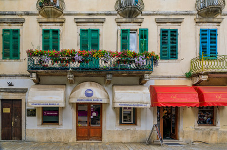 Kotor, Montenegro - May 30 2019: Picturesque cobblestone city square of the well preserved medieval Old town with shops and restaurants in the Balkansのeditorial素材