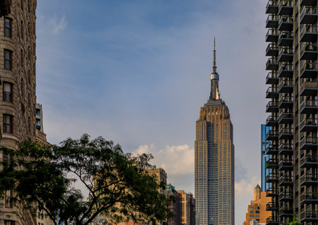 New York, USA - July 29, 2019: View of the city skyline and art deco masterpiece, Empire State Building from street level in Midtown Manhattanのeditorial素材