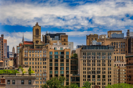 New York, USA - August 1, 2019: Aerial view of residential and office buildings in the iconic skyline in Midtown Manhattan against a cloudy skyのeditorial素材