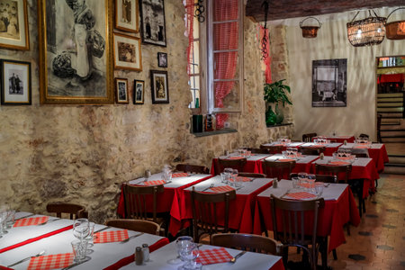 Nice, France - June 3, 2019: View of a traditional rustic nicois restaurant with indoor seating in the streets of Old Town Vielle Villeのeditorial素材