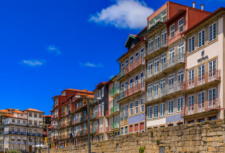 Porto, Portugal - May 29, 2018: Facades of traditional houses decorated with ornate Portuguese azulejo tiles in the famous Ribeira neighborhoodのeditorial素材