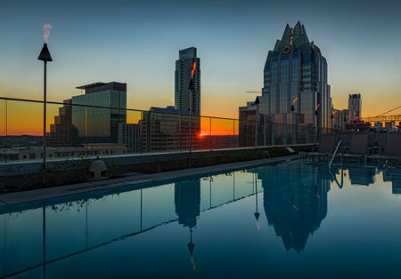 Austin, Texas USA - January 27, 2020: View of the rooftop pool and downtown skyline with the landmark Frost Bank Tower from The Westin hotel at sunsetのeditorial素材