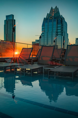 Austin, Texas USA - January 27, 2020: View of the rooftop pool and downtown skyline with the landmark Frost Bank Tower from The Westin hotel at sunsetのeditorial素材