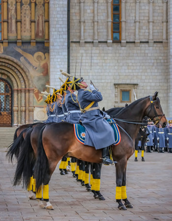Moscow, Russia - October 10, 2015: Changing of the Presidential Guards, cavalry guards saluting with raised naked sabres in the Kremlin Complexのeditorial素材