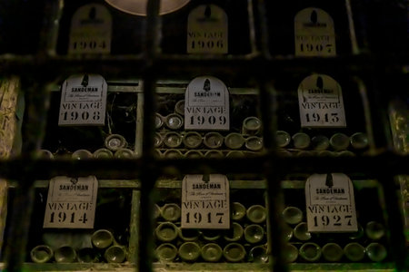 Porto, Portugal - May 31, 2018: Stored branded barrels of port wine on display at Sandeman cellar, popular brand founded in 1790 in Vila Nova de Gaiaのeditorial素材