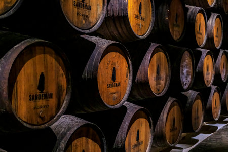 Porto, Portugal - May 31, 2018: Stored branded barrels of port wine on display at Sandeman cellar, popular brand founded in 1790 in Vila Nova de Gaiaのeditorial素材