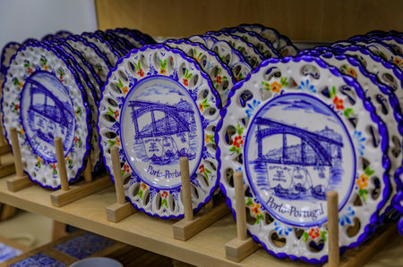Porto, Portugal - May 29, 2018: Detail of traditional ornate azulejo Portuguese ceramic plates on display at a souvenir shopのeditorial素材