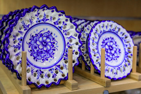 Porto, Portugal - May 29, 2018: Detail of traditional white and blue ornate azulejo Portuguese ceramic plates on display at a souvenir shopのeditorial素材