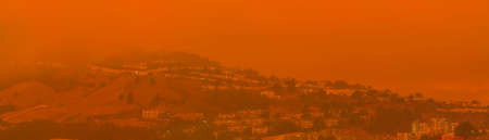 Thick orange haze above San Francisco on September 9 2020 from record wildfires in Californa, daytime view of ash and smoke floating over the Bay Areaの写真素材