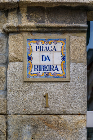 Porto, Portugal - May 29, 2018: Praca da Ribeira 1 street sign with ornate Portuguese azulejo tiles...