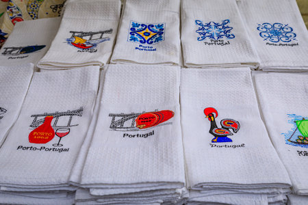 Porto, Portugal - May 31, 2018: Souvenir hand kitchen towels with traditional Portuguese symbols on display at a shopのeditorial素材