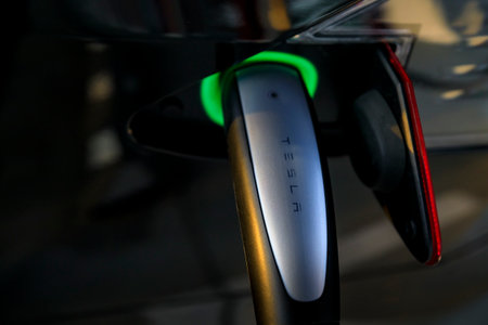 Firebaugh, USA - January 21, 2021: Charging port of a black electric luxury Tesla Model S 75D car...
