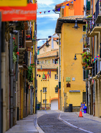 Pamplona, Spain - June 20, 2021: Colorful houses with flowers and cobblestone streets in the old town in Pamplona, famous for running of the bullsのeditorial素材