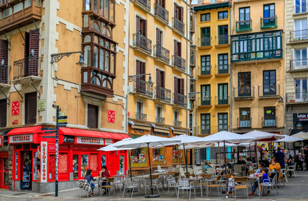 Pamplona, Spain - June 21, 2021: People in street cafes on Plaza Consistorial in the old town or Casco Viejo famous for running of the bullsのeditorial素材