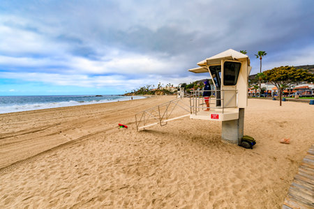 Laguna Beach, United States - January 22, 2021: Lifeguard on duty at the famous tourist destination beach in California on a cloudy dayのeditorial素材