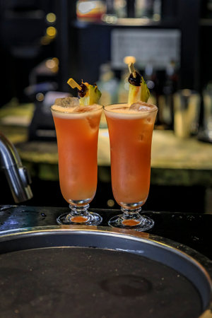 Singapore - September 08, 2019: Singapore Sling cocktail at the iconic Raffles Hotel Long Bar, famous for inventing itのeditorial素材