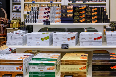 Madrid, Spain - June 28, 2021: Chocolate bars on display at Torrons Vicens store, artisanal...