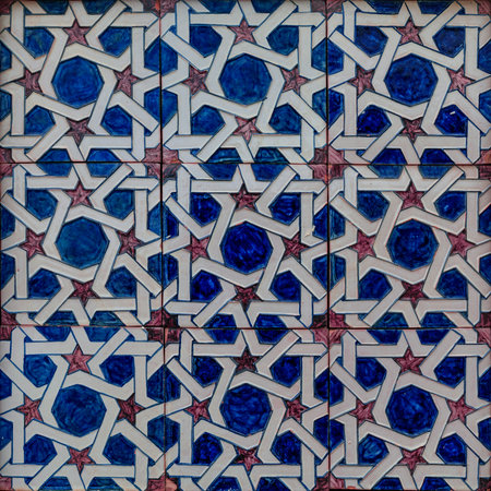 Close up details of a traditional Moroccan Zellige tile pattern mosaic in Olite, Spain famous for a...