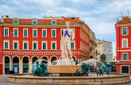 Nice, France - May 25 2022: Statue of Apollo with a blue awareness ribbon in support against multiple sclerosis at Fountain du Soleil on Place Massenaのeditorial素材