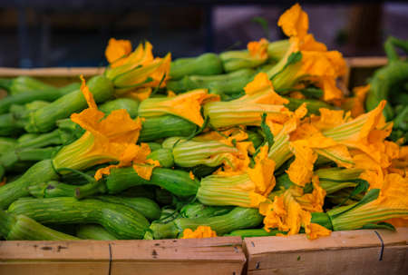 Traditional delicacy from South of France courgette or zucchini flowers at an outdoor farmers market Cours Saleya in the Old Town Nice, French Rivieraの写真素材